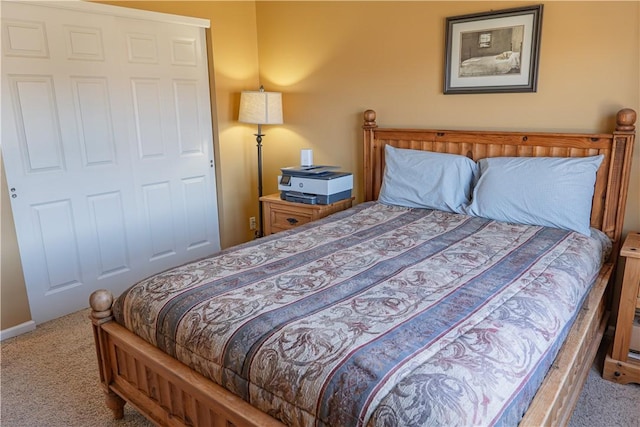 carpeted bedroom with baseboards