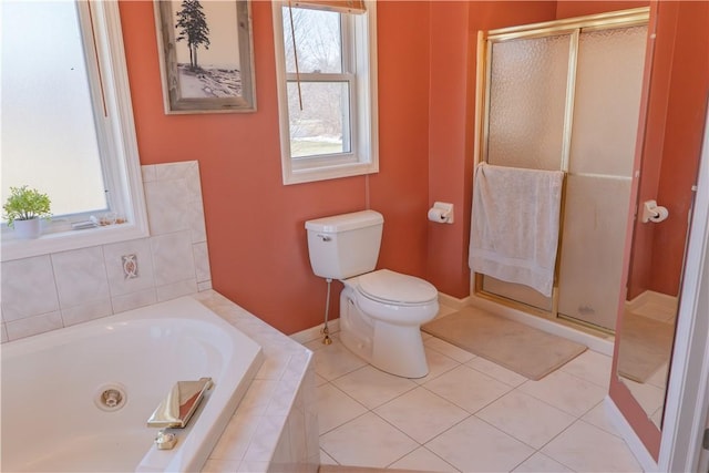 full bath with tile patterned floors, a jetted tub, toilet, and a shower stall