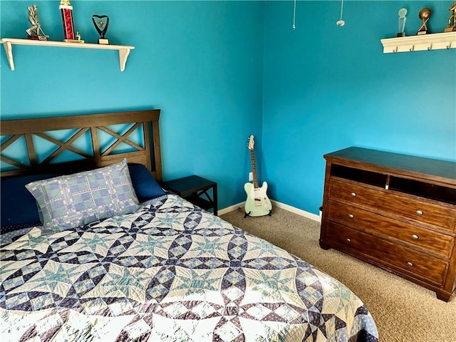 bedroom with baseboards and carpet floors