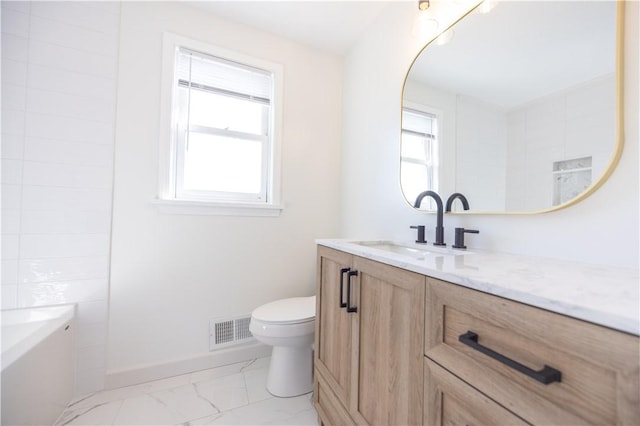 full bathroom featuring visible vents, toilet, marble finish floor, a bathing tub, and vanity