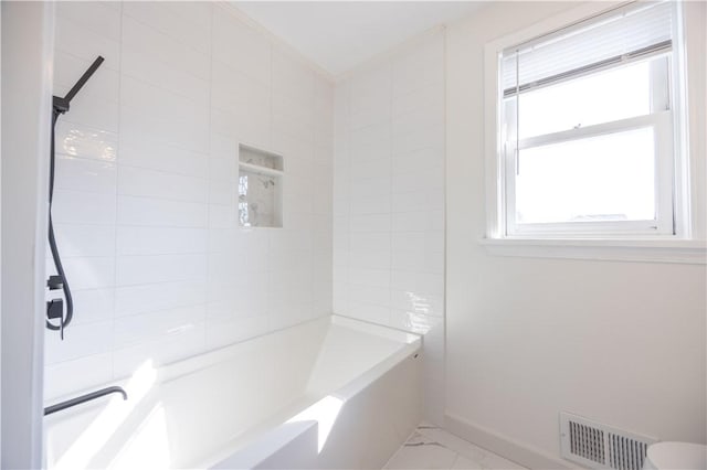 bathroom featuring visible vents, baseboards, marble finish floor, and shower / bathtub combination