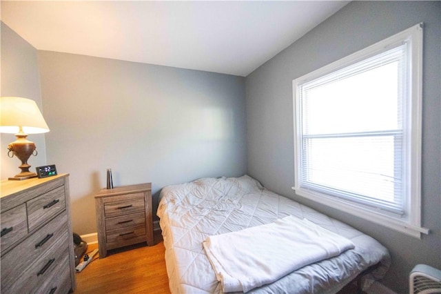 bedroom featuring light wood-style flooring