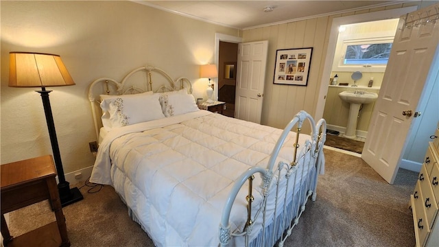 bedroom featuring a sink, carpet flooring, and crown molding