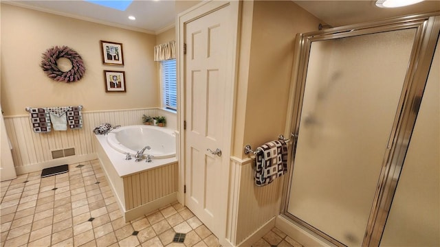 bathroom featuring tile patterned flooring, a shower stall, ornamental molding, wainscoting, and a bath