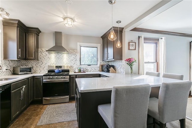 kitchen featuring a peninsula, dishwasher, gas range, wall chimney range hood, and tasteful backsplash