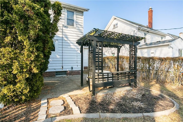 view of yard featuring a patio area, fence, and a pergola