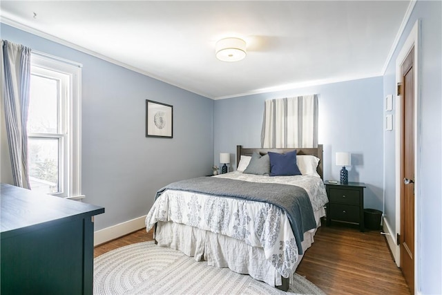 bedroom featuring dark wood-style floors and baseboards