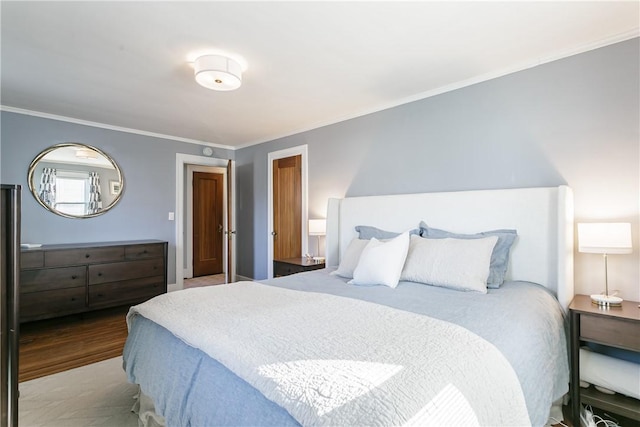 bedroom featuring wood finished floors and ornamental molding