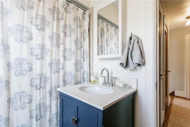 bathroom featuring vanity and a shower with shower curtain