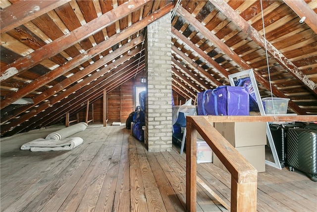 attic featuring an upstairs landing