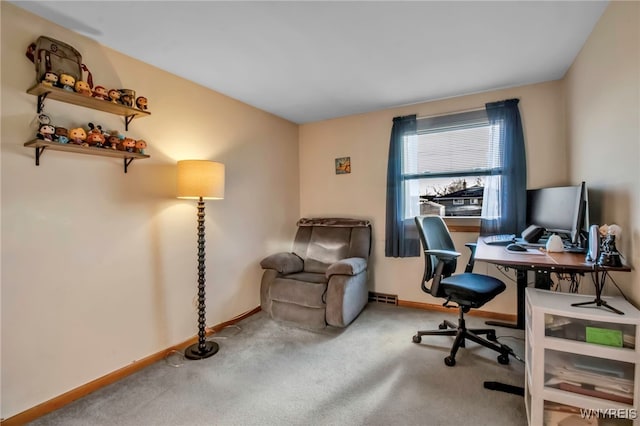 office with baseboards and carpet floors