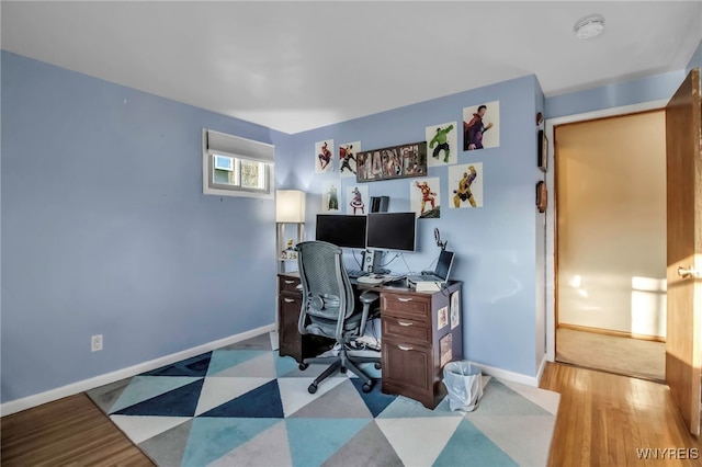 office with tile patterned floors and baseboards