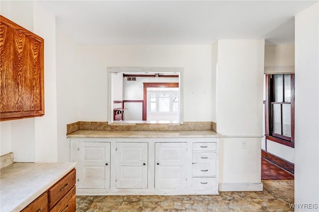 kitchen with brown cabinets and light countertops