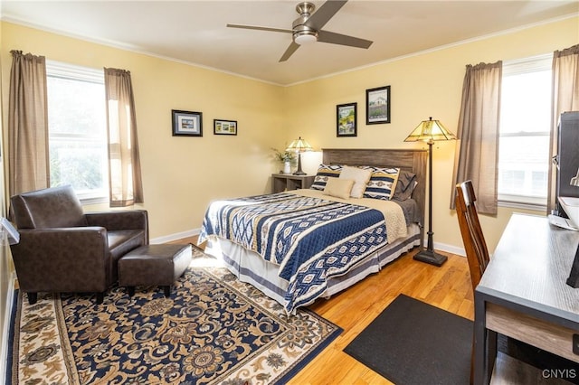 60 E Elizabeth St, Skaneateles, NY 13152 - bedroom with wood finished floors, multiple windows, crown molding, and baseboards
