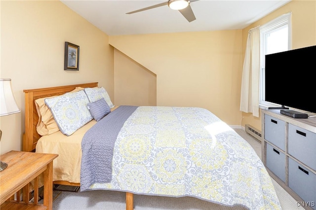 bedroom with a baseboard radiator, ceiling fan, and carpet flooring