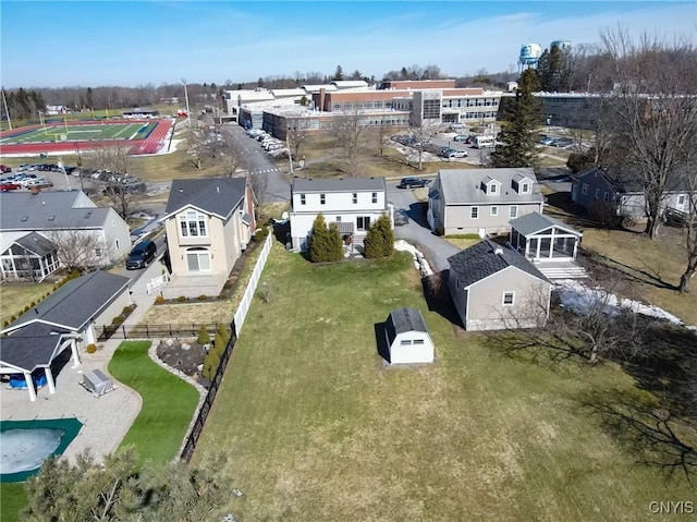 birds eye view of property with a residential view