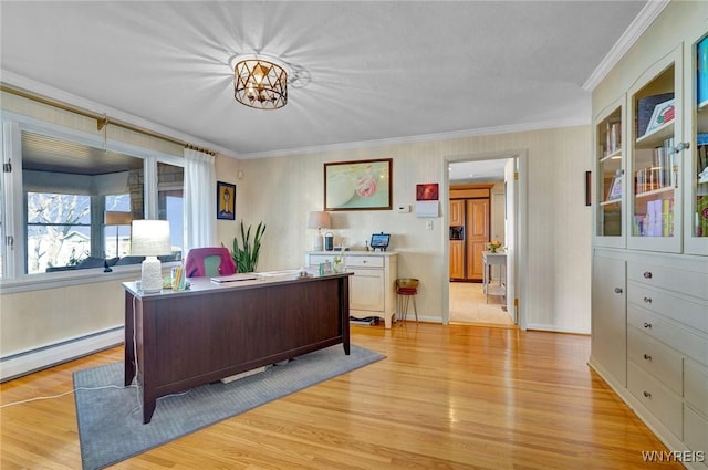 home office featuring a baseboard heating unit, crown molding, and light wood-style floors