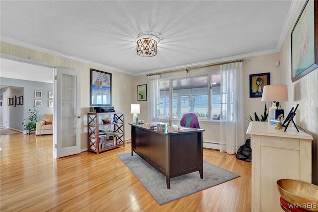 home office featuring a baseboard heating unit, light wood-style floors, and ornamental molding