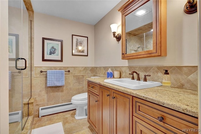 bathroom with toilet, a stall shower, tile walls, and a baseboard radiator