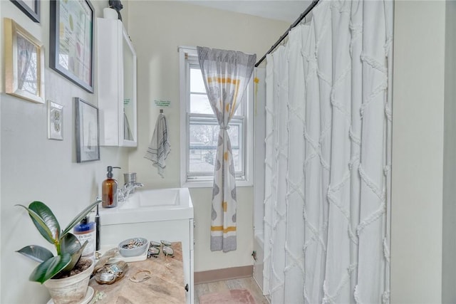 full bath with vanity and shower / bath combo