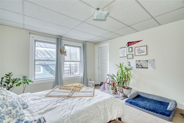 bedroom featuring a paneled ceiling