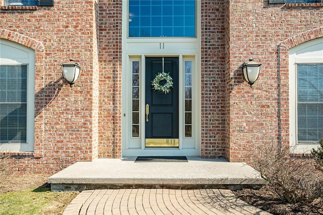 entrance to property with brick siding