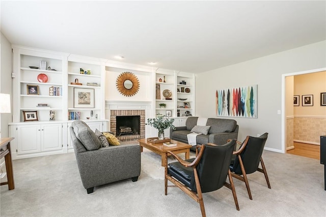 living area featuring light colored carpet and a fireplace