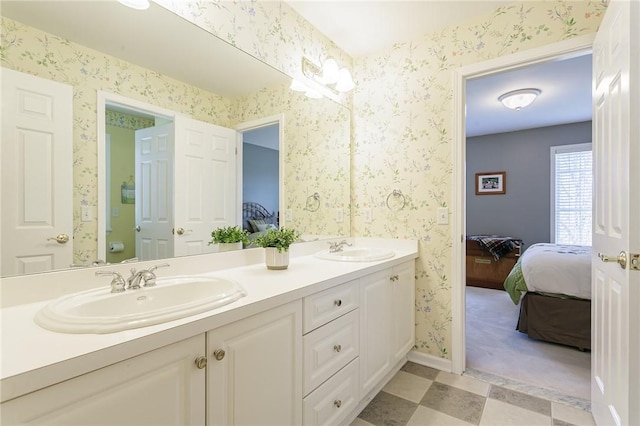 bathroom featuring wallpapered walls and ensuite bathroom