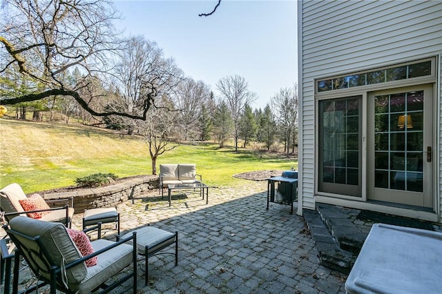 view of patio featuring a grill