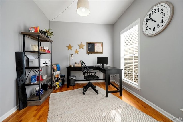 office featuring baseboards and wood finished floors