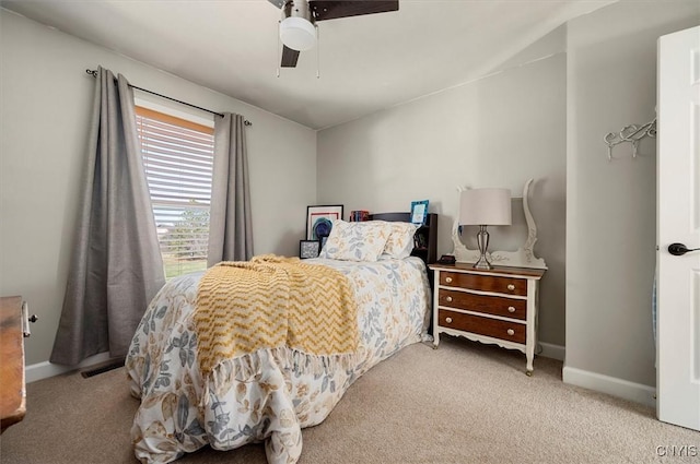 bedroom featuring baseboards, ceiling fan, and carpet flooring