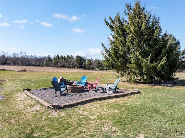 view of yard with a patio area and an outdoor fire pit