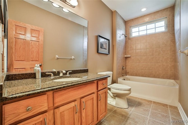 bathroom featuring vanity, toilet, washtub / shower combination, and tile patterned flooring