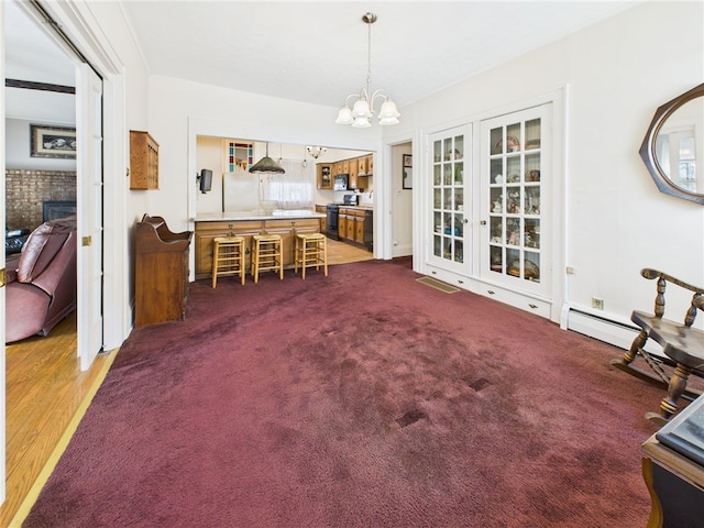 unfurnished dining area with a chandelier, visible vents, carpet flooring, and a fireplace