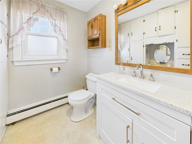 bathroom with baseboard heating, vanity, and toilet