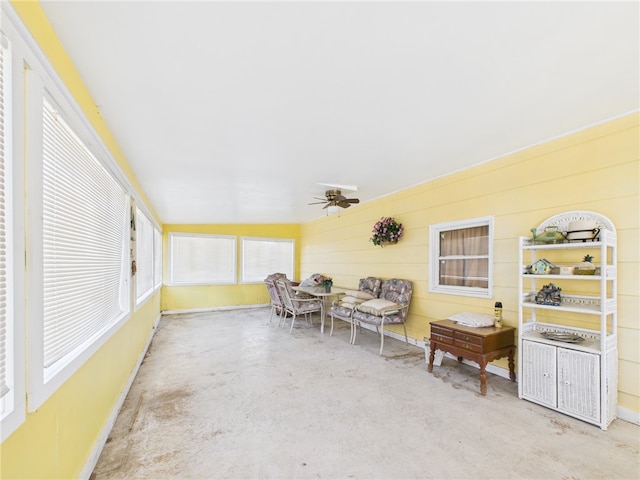 sunroom featuring plenty of natural light and ceiling fan