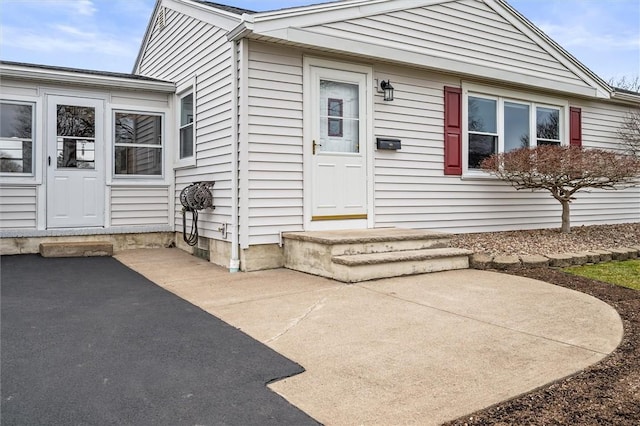 doorway to property with a patio