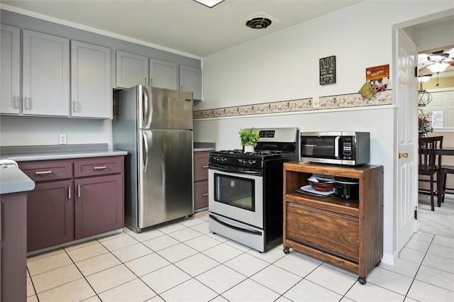 kitchen with light tile patterned floors, visible vents, and appliances with stainless steel finishes