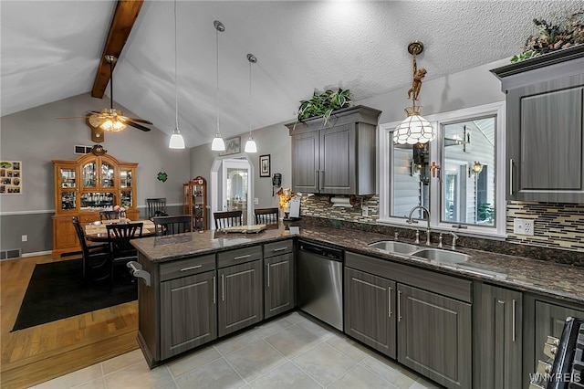 kitchen featuring gray cabinetry, a sink, tasteful backsplash, a peninsula, and dishwasher