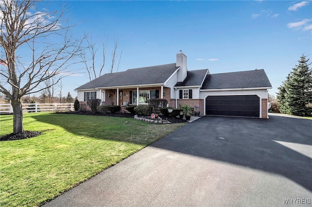 single story home with fence, a front yard, a garage, brick siding, and a chimney