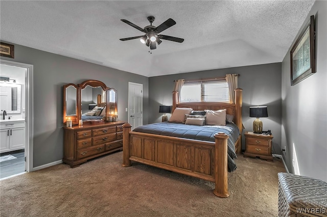 bedroom with connected bathroom, ceiling fan, baseboards, carpet floors, and a textured ceiling