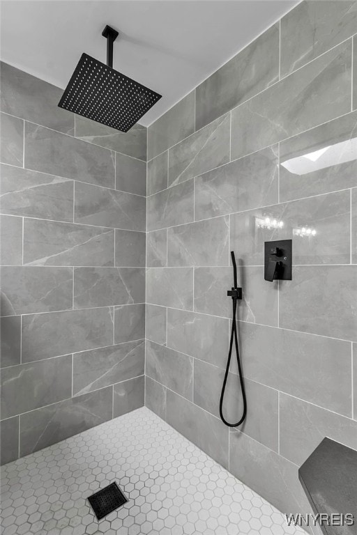 bathroom with tiled shower