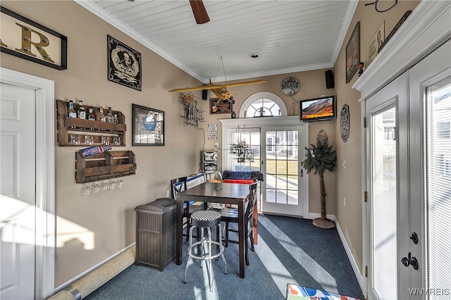 dining space featuring crown molding, plenty of natural light, and french doors