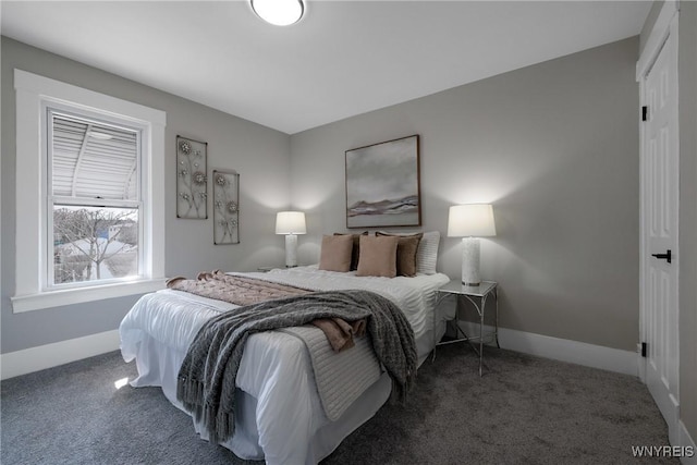 bedroom featuring baseboards and carpet flooring