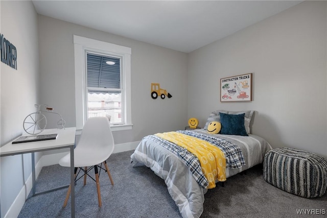 bedroom with baseboards and carpet floors