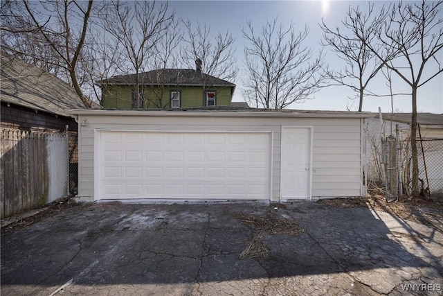 detached garage with fence