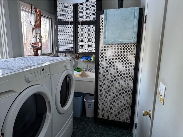 clothes washing area with laundry area and washer and dryer