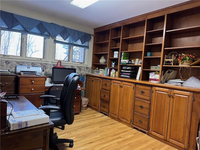 home office with light wood-type flooring