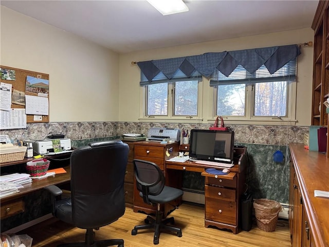 office area featuring a baseboard radiator, a wainscoted wall, tile walls, and light wood finished floors