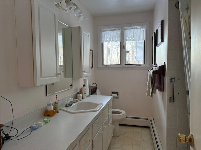 full bathroom featuring a baseboard radiator, toilet, and vanity